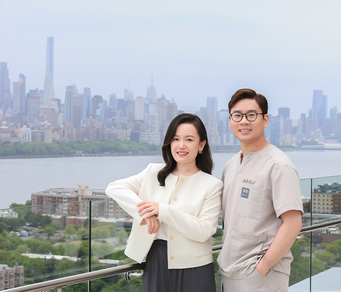 Dr. Chang and Bingxin Zhao next to view of city