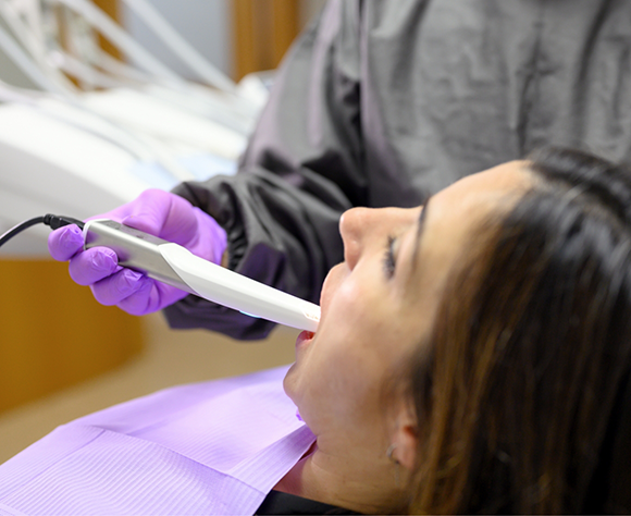 Female patient having digital impressions taken