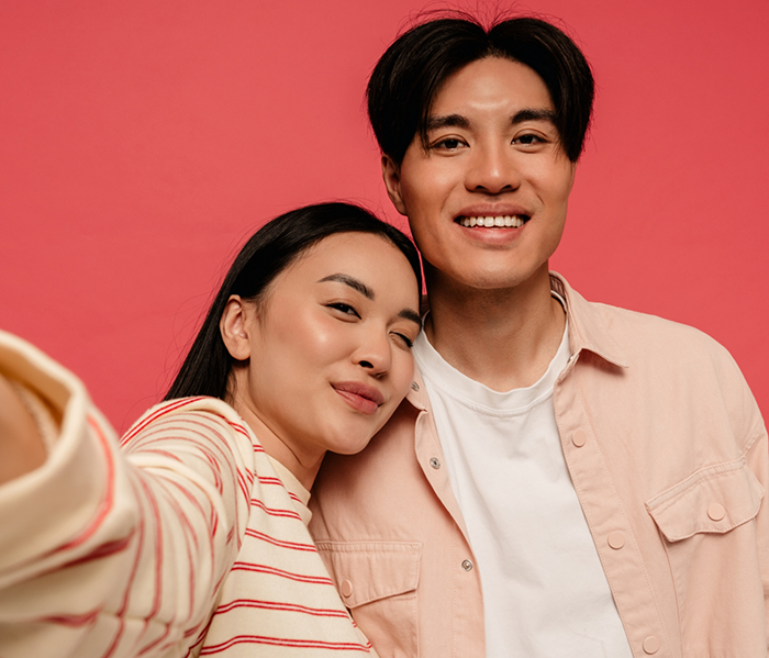 Man and woman taking selfie