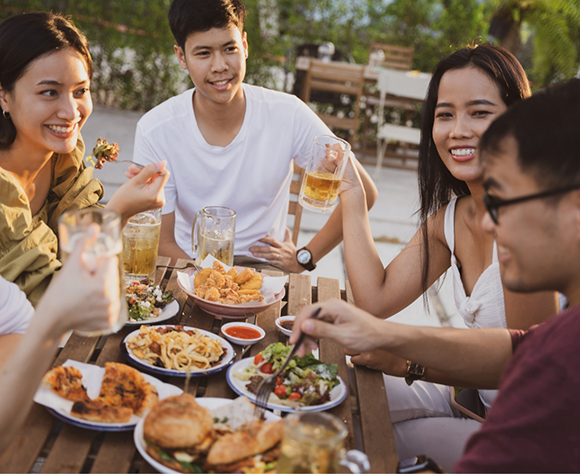 Gathered around table enjoying a meal