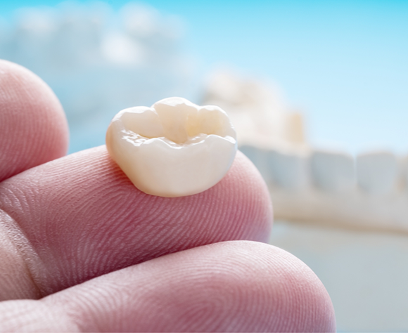 Close up of crown on fingers