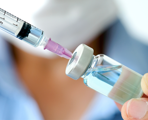Syringe being filled with botulinum toxin