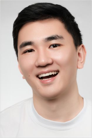 Man in white shirt smiling